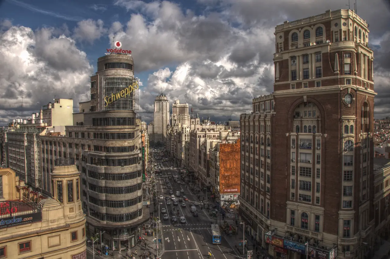 Gran Vía street from above, with the Schweppes-topped Carrión building in the foreground and Edificio España visible down the avenue