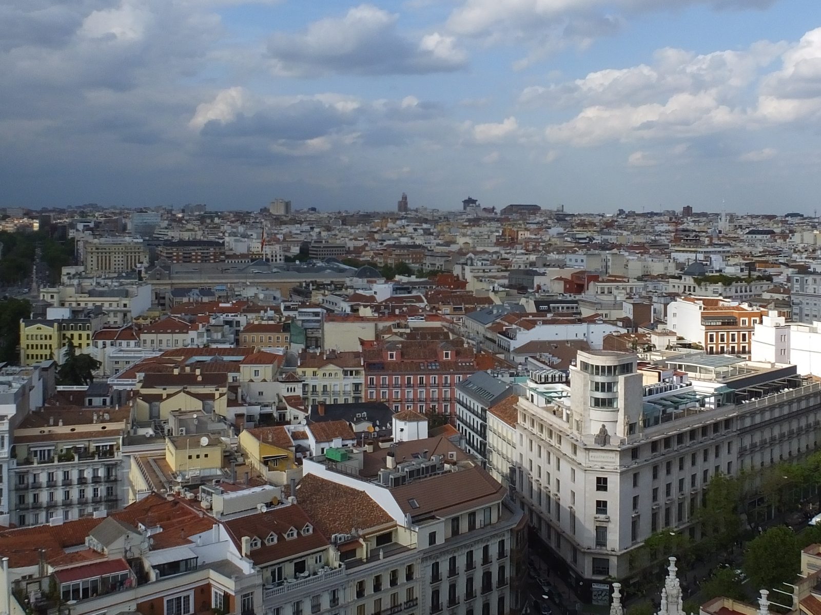 Rooftop view over the dense apartment blocks and terracotta roofs of central Madrid
