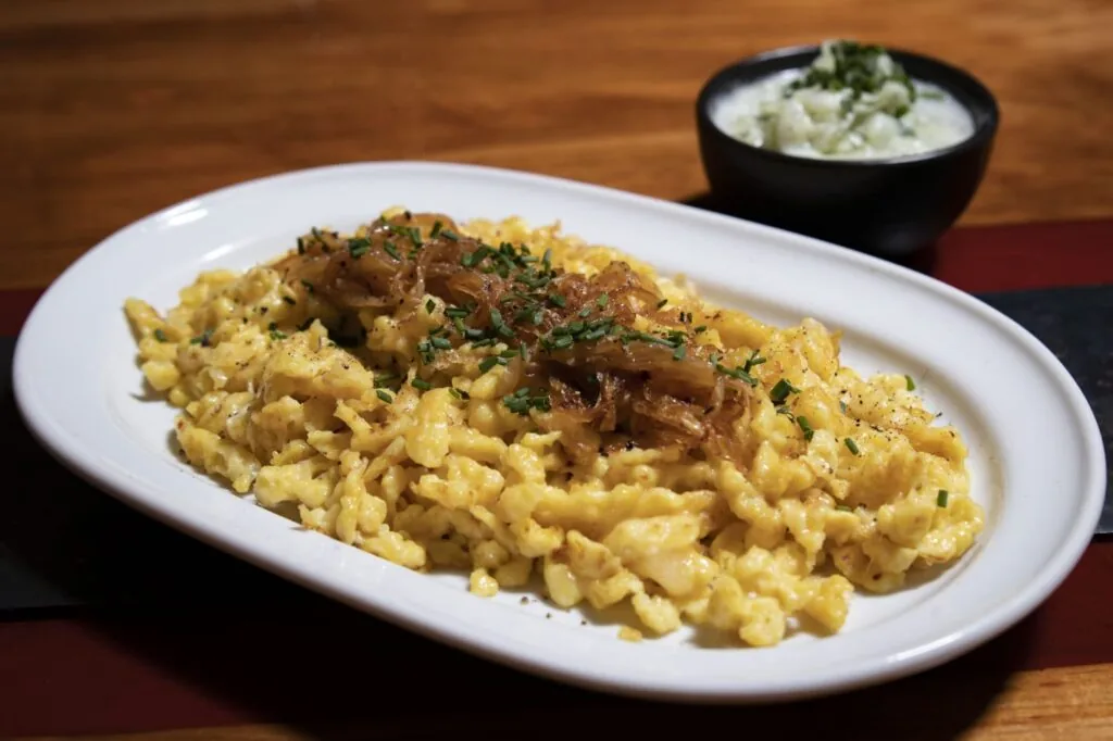A plate of spaetzle noodles with caramelized onions