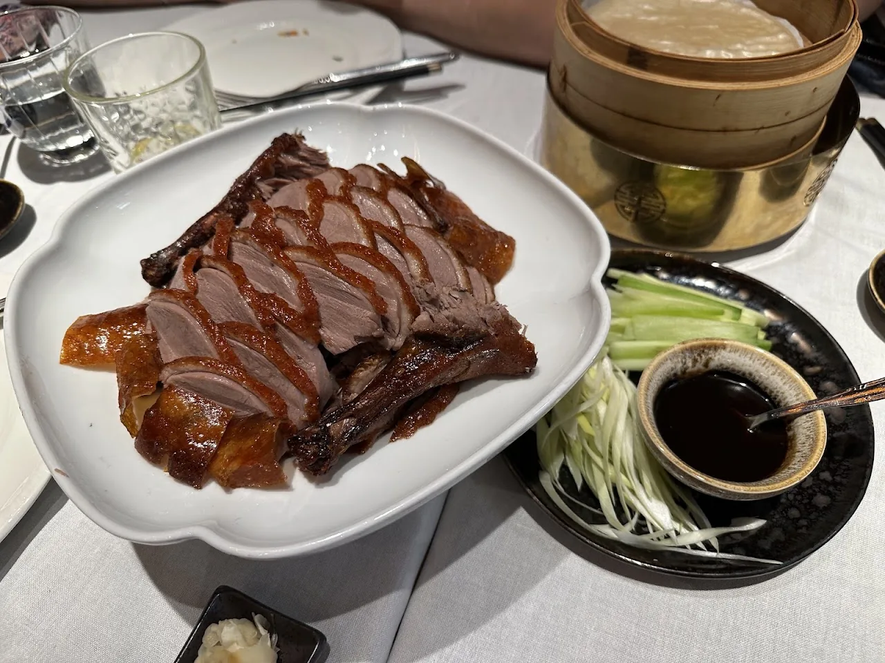Glazed ribs or duck slices with a dipping sauce