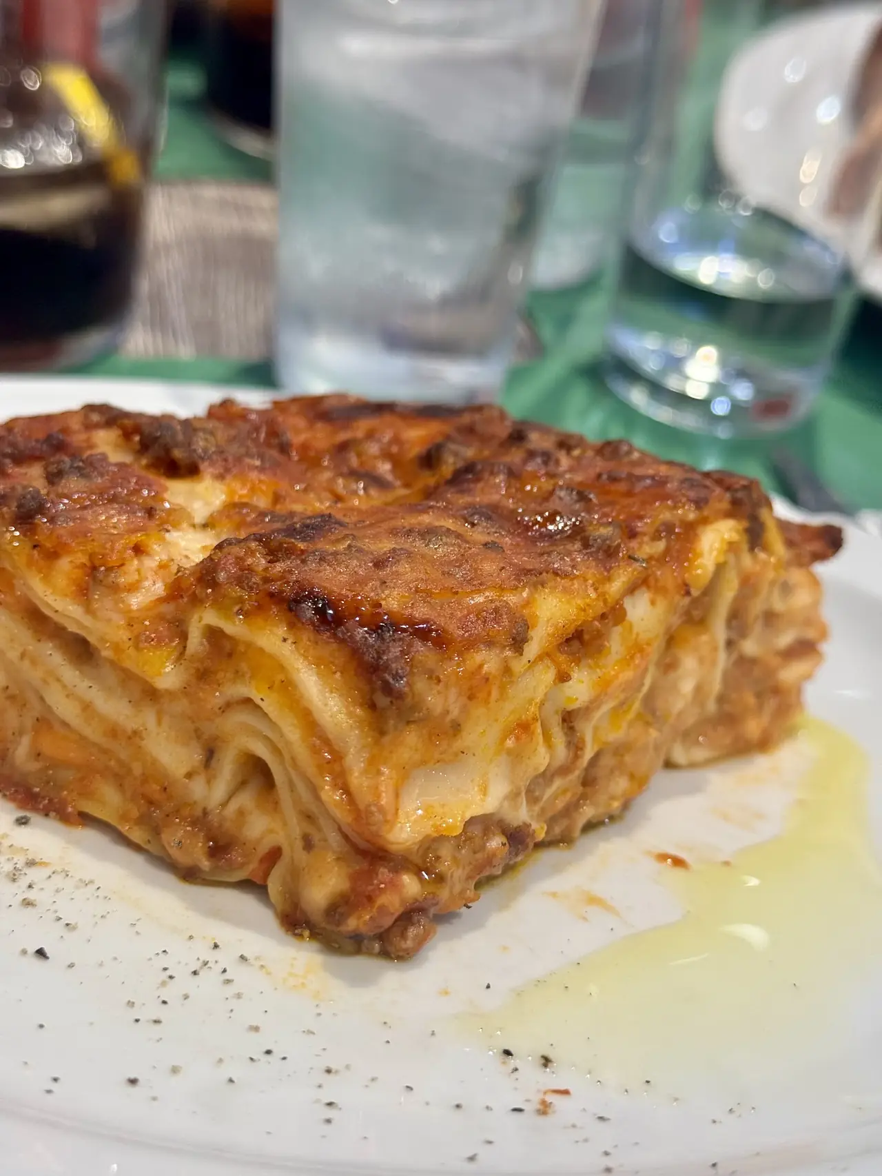 Slice of layered meat lasagna on a plate