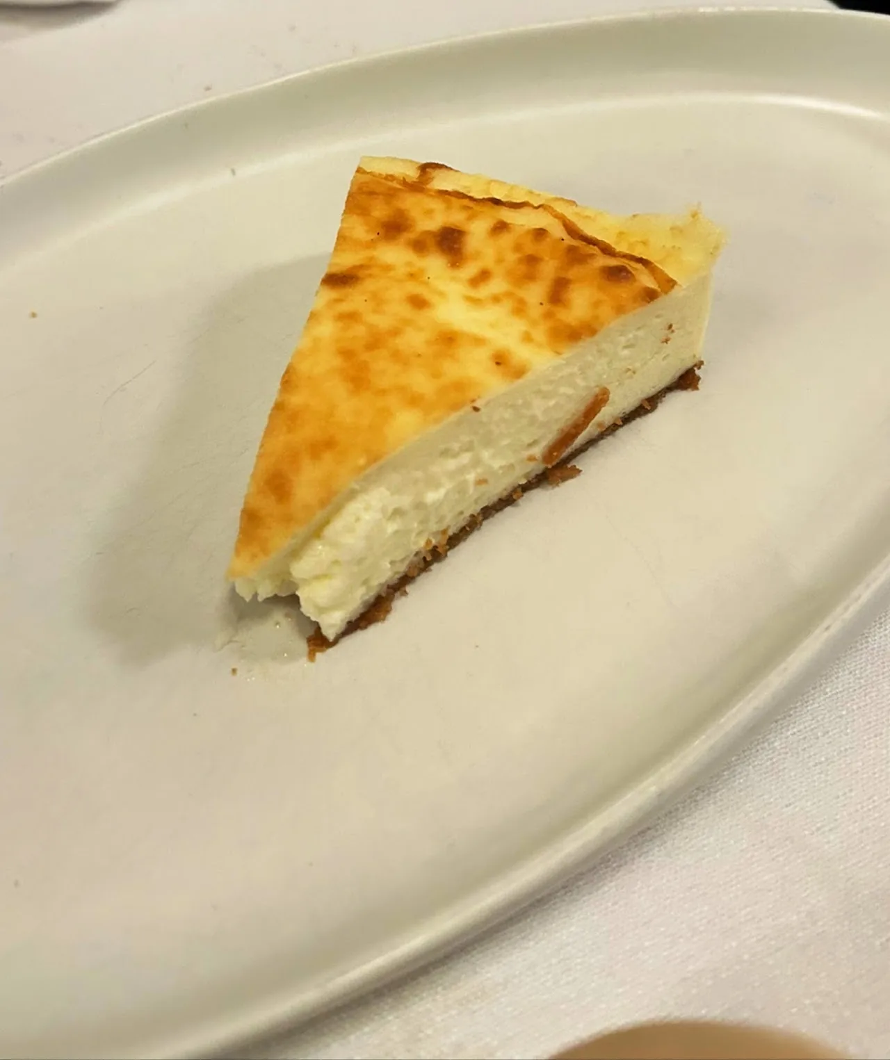 A slice of baked cheesecake