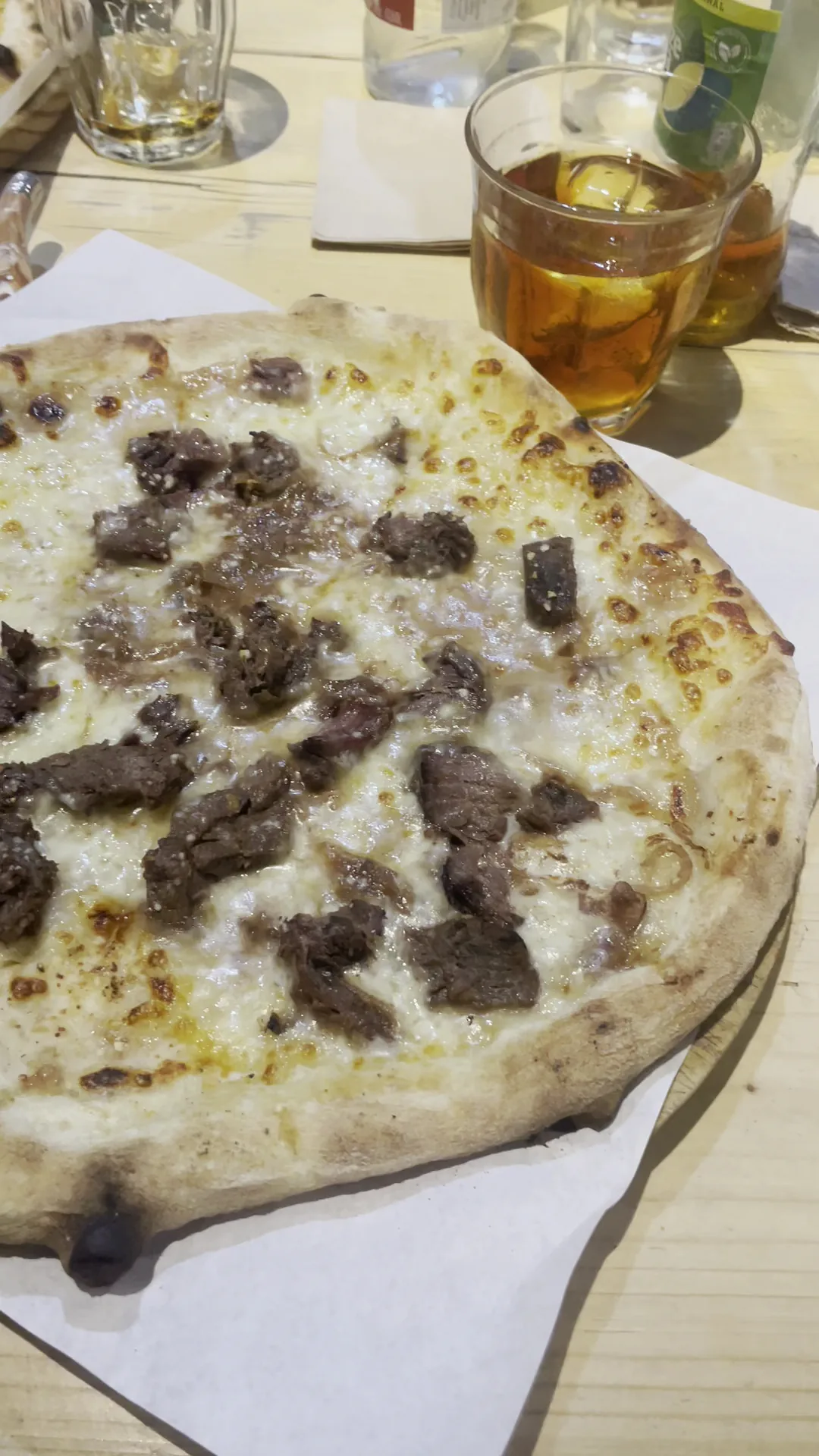 A pizza topped with chunks of meat