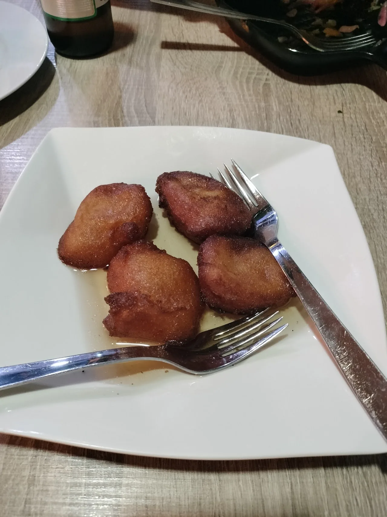 Four fried empanadas on a plate