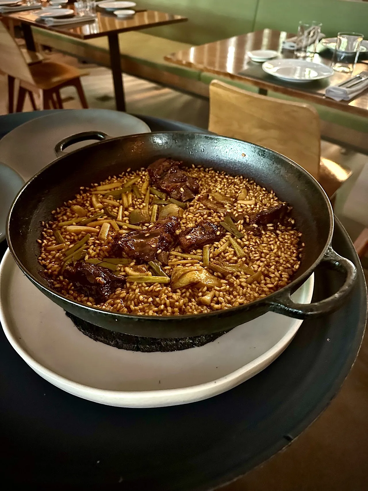 A pan of rice with meat and vegetables