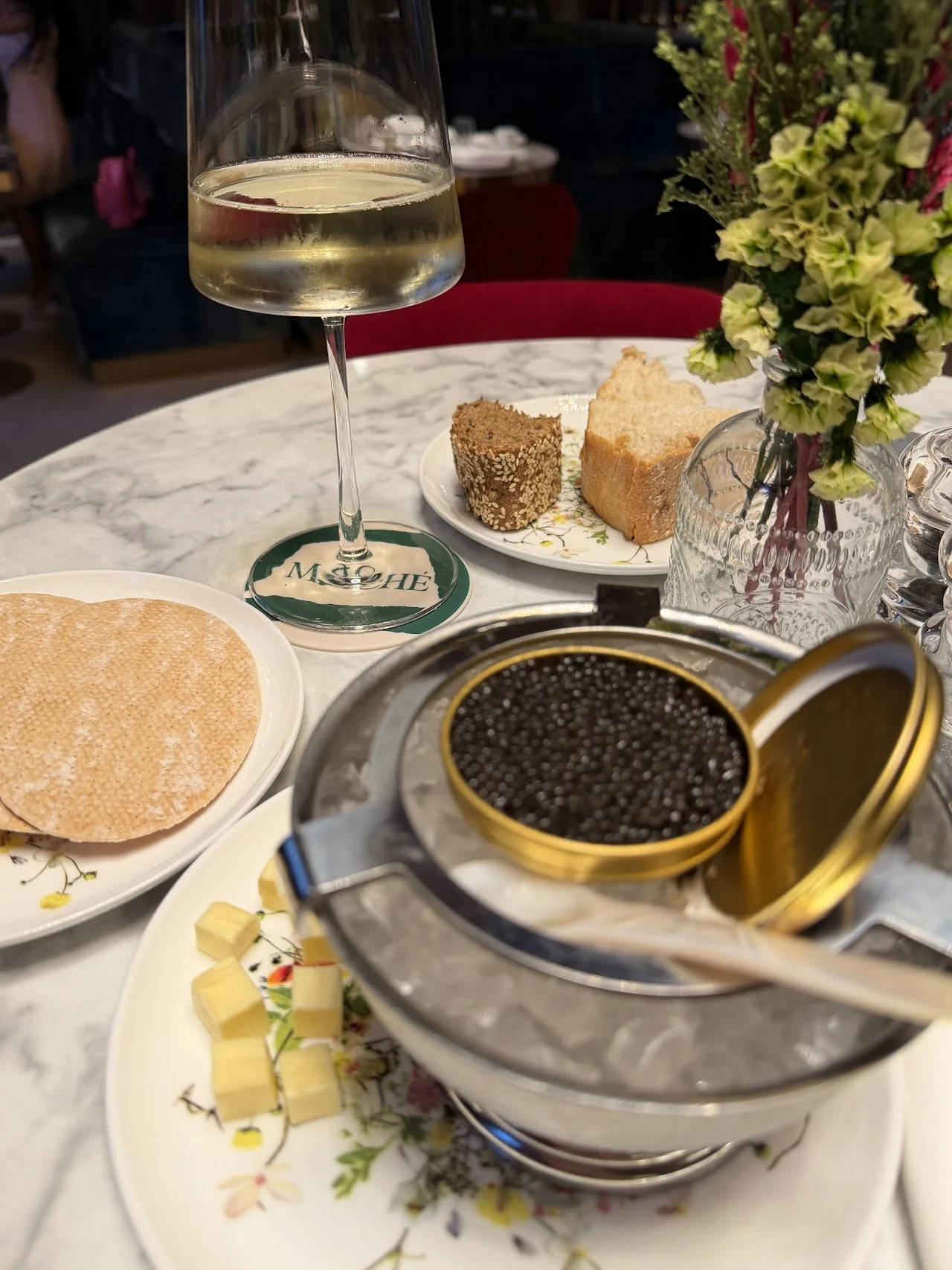 Tins of caviar served with blini and toast points