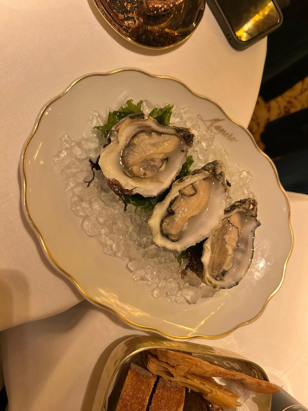 Two oysters on the half shell served on ice