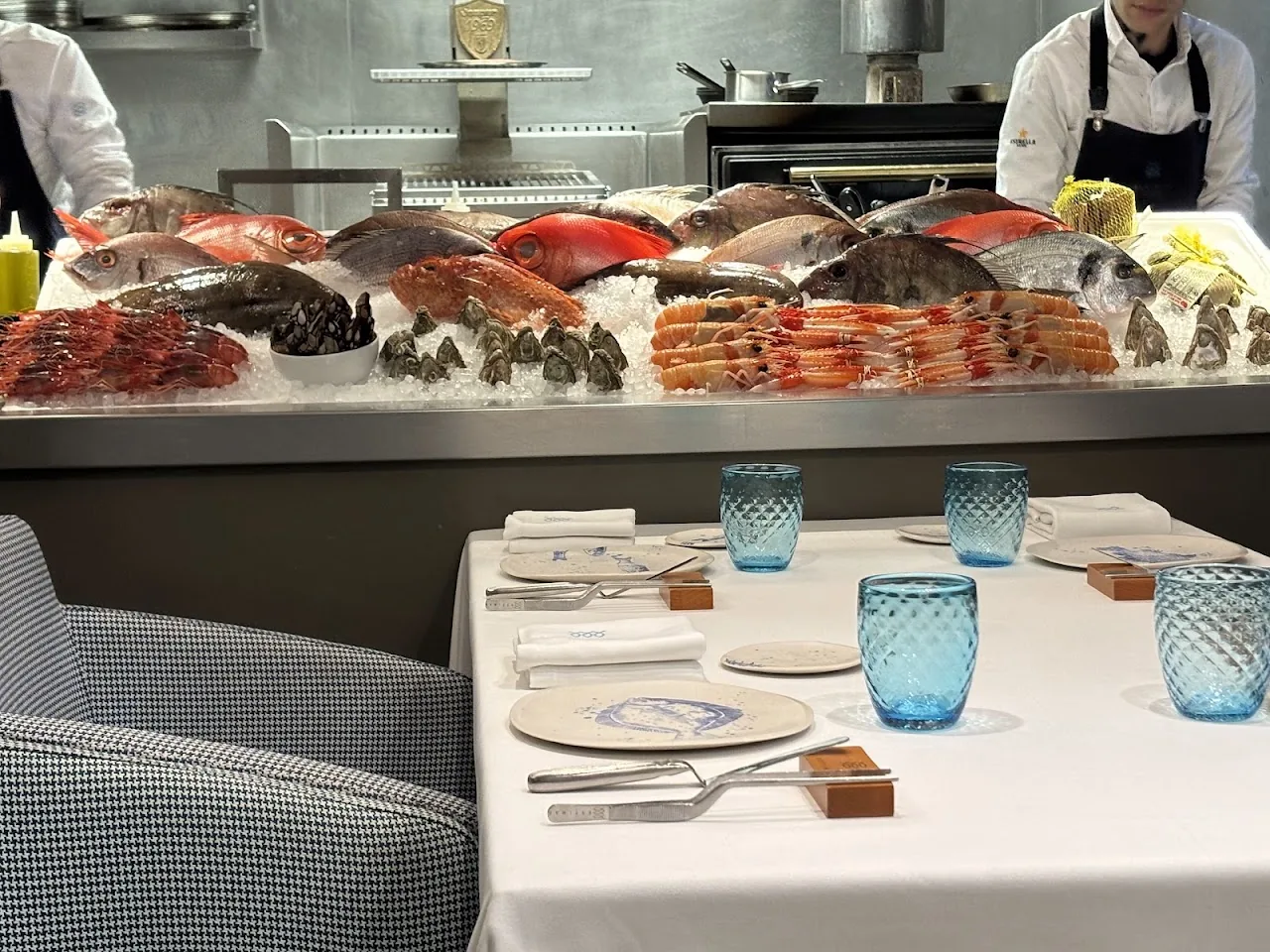 A chilled seafood display case with an assortment of whole fresh fish