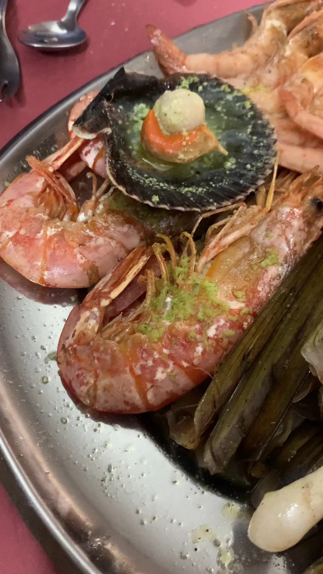 Grilled prawns with a stuffed shellfish garnish