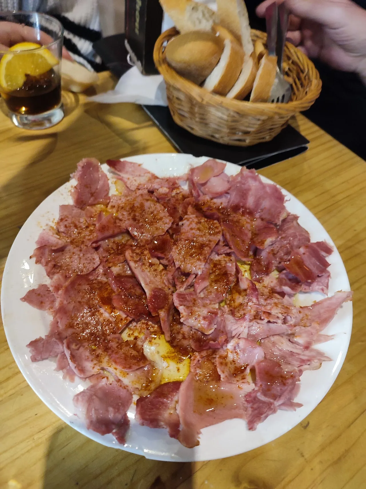 A plate of thinly sliced cured ham