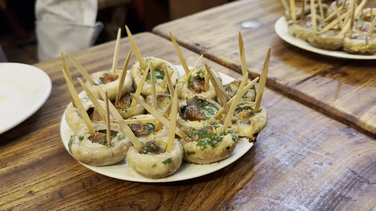 Stuffed grilled mushrooms served with toothpicks