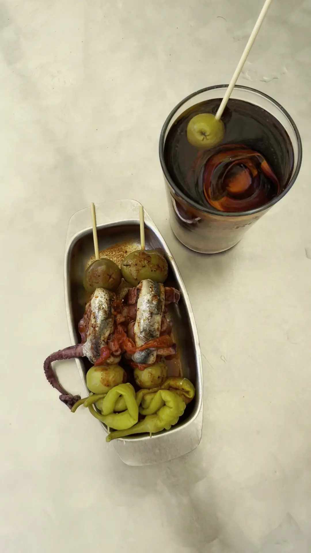 Tin of mussels served with pickled guindilla peppers and olives, at Morro Fi.