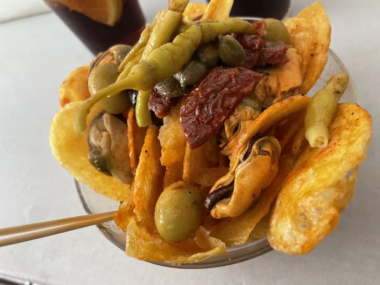 Crisps topped with olives, sun-dried tomato and pickled guindilla peppers, at Morro Fi.