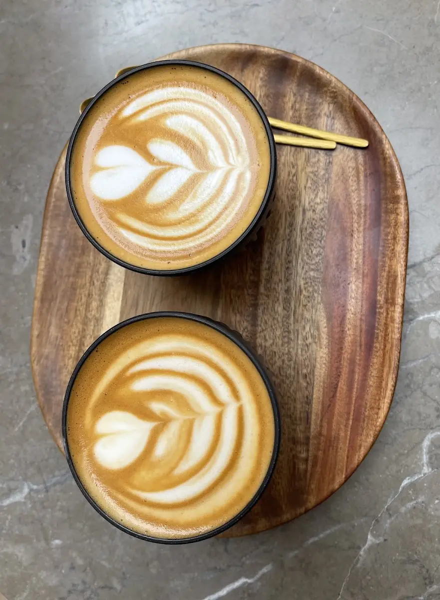 Latte art on the tasting board at Nano Coffee Lab