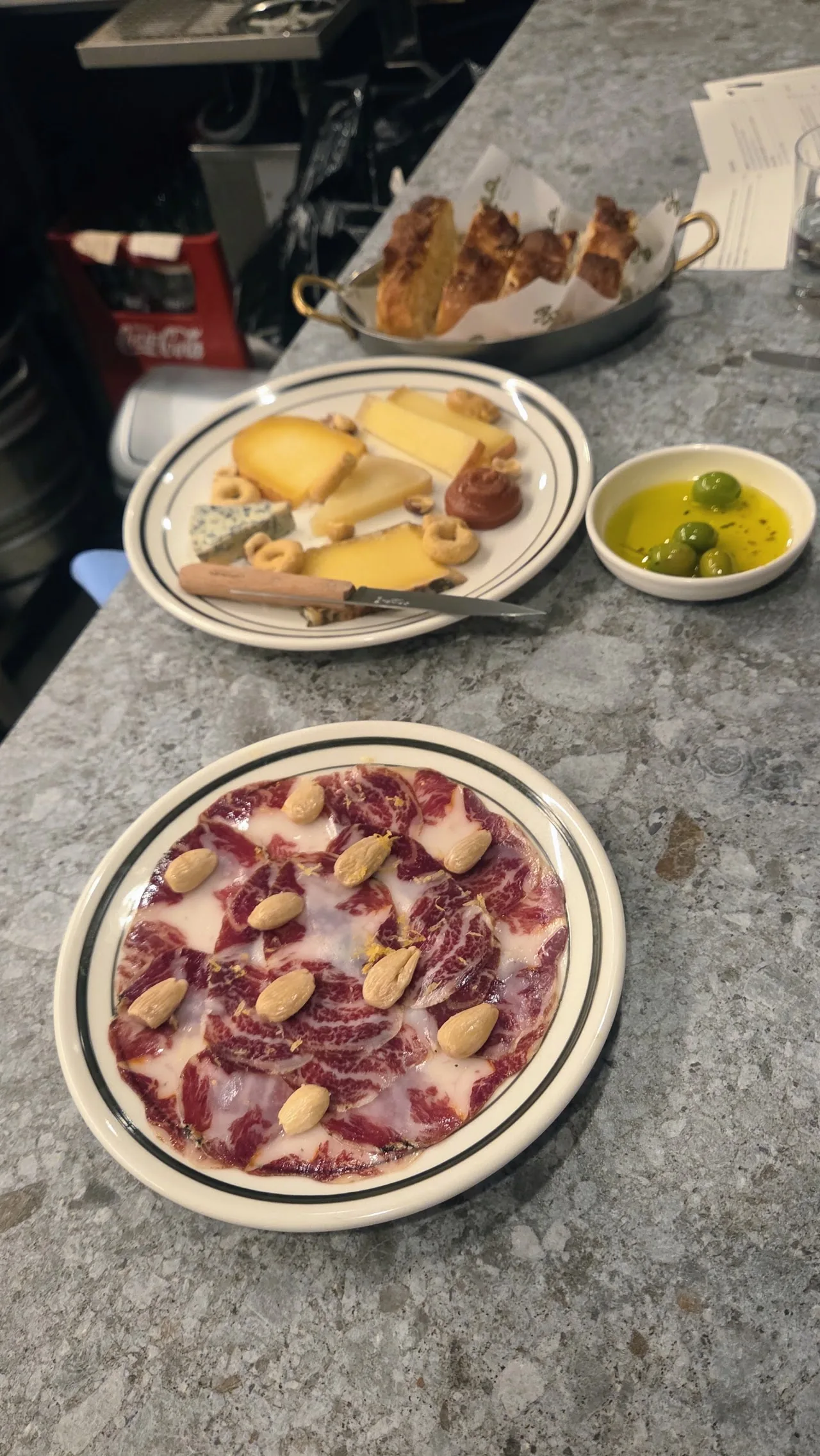 Charcuterie and cheese platters with olive oil and bread