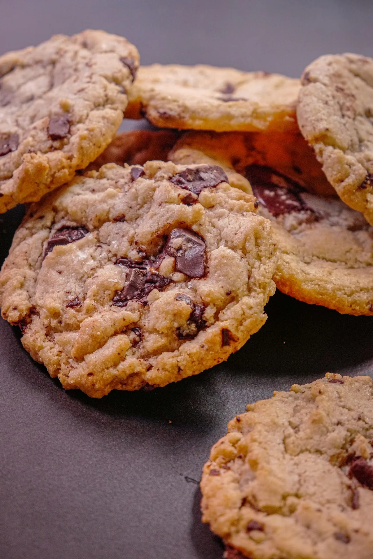 A pile of chocolate chip and jam-filled cookies