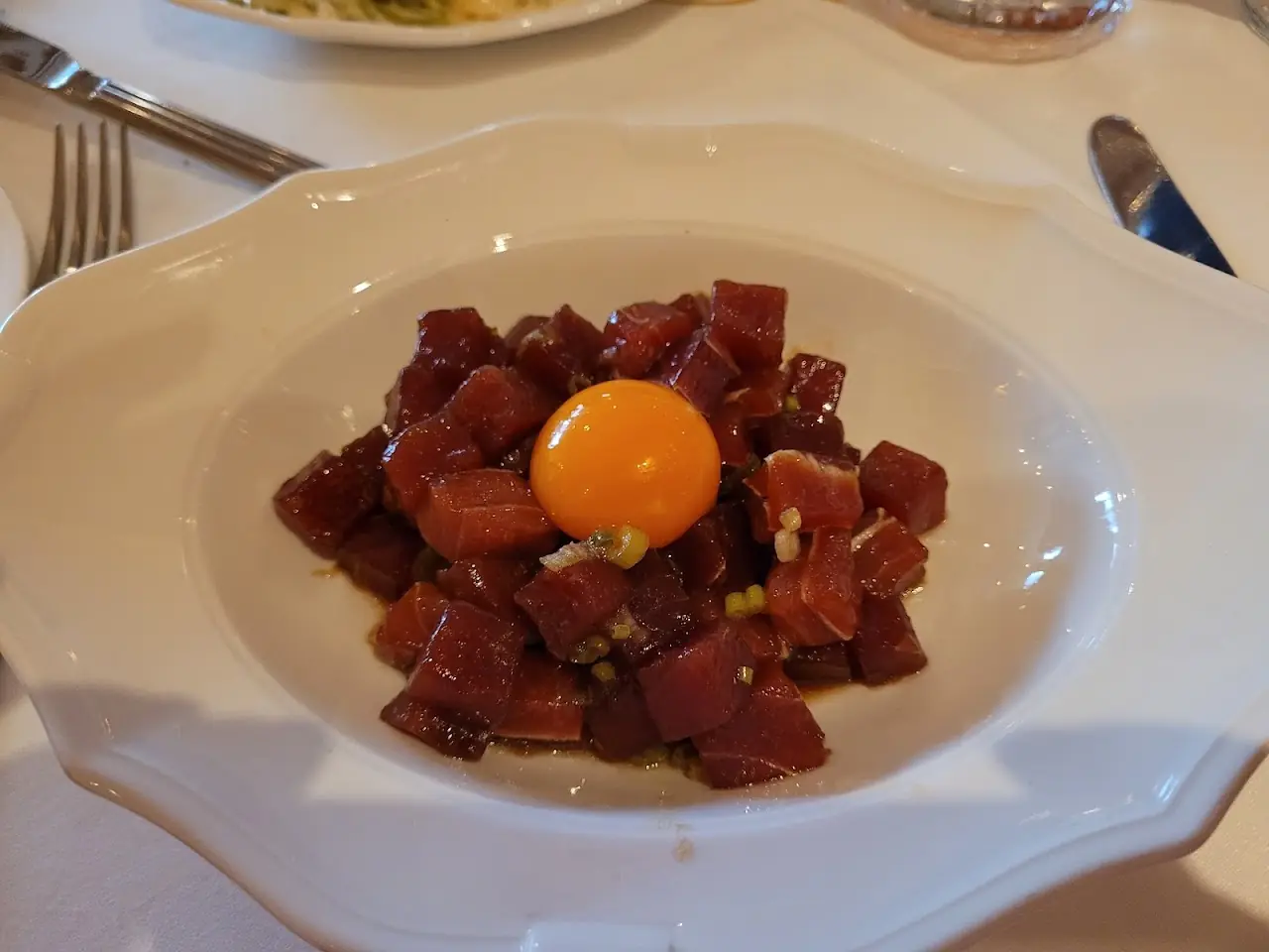 Beef tartare topped with a raw egg yolk