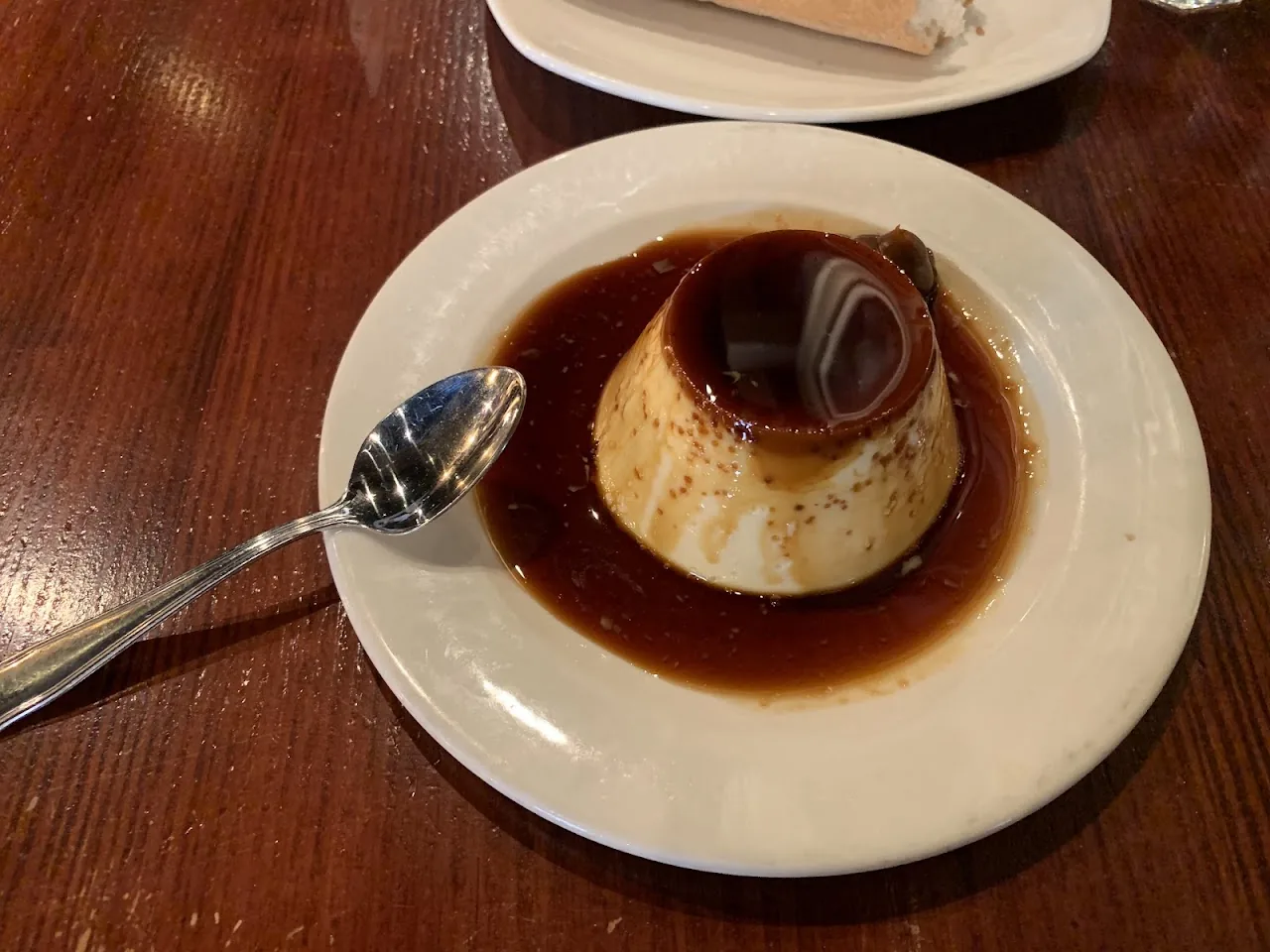 A flan dessert with caramel sauce on a plate