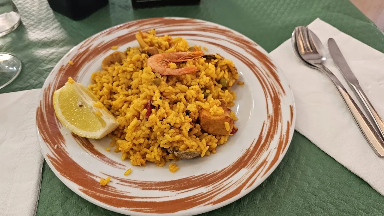 A pan of paella with mussels and shrimp