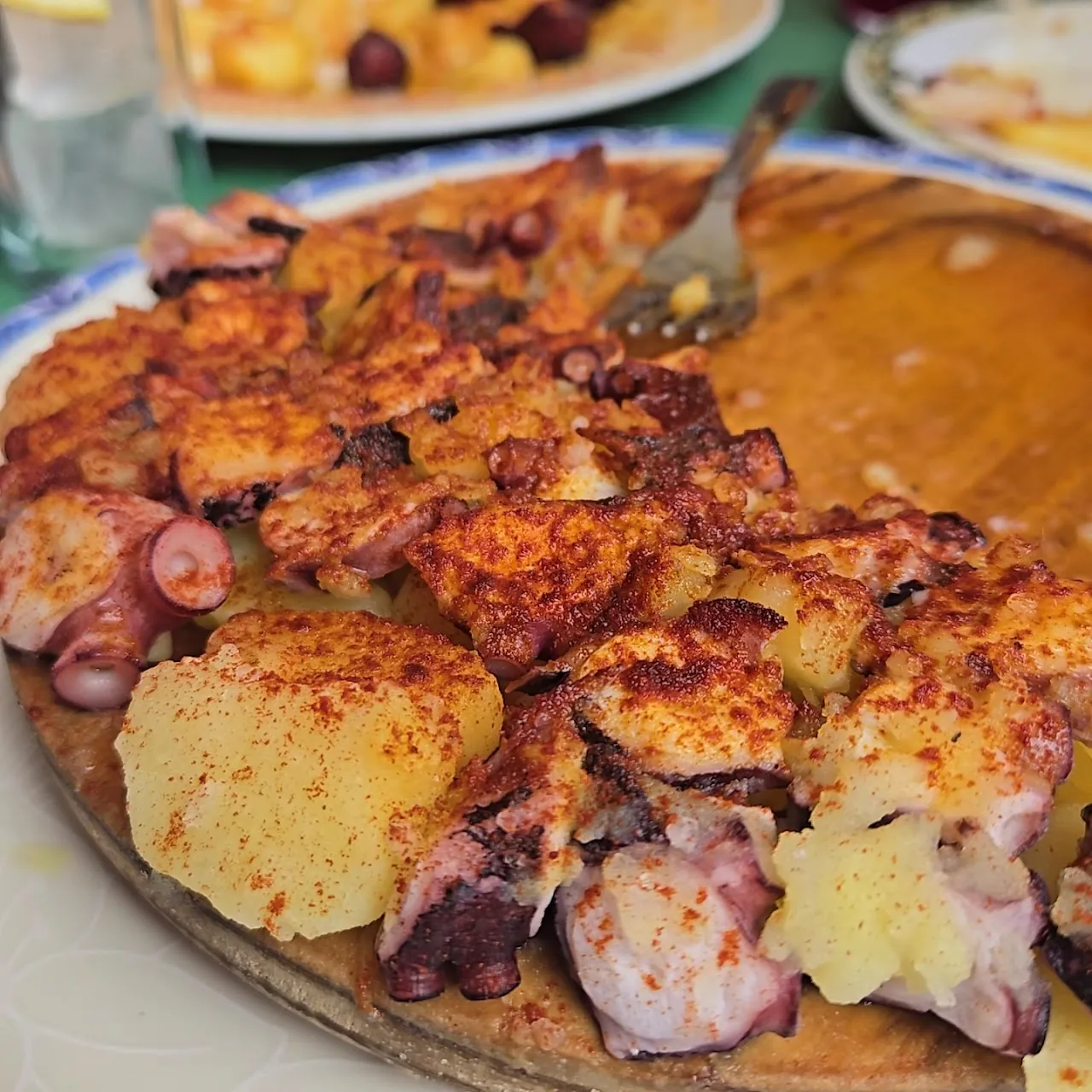 Grilled octopus with potatoes, dusted with paprika