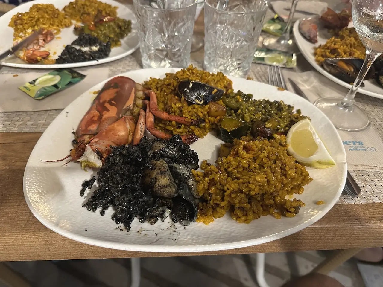 Seafood platter with black rice and paella at Pipper's
