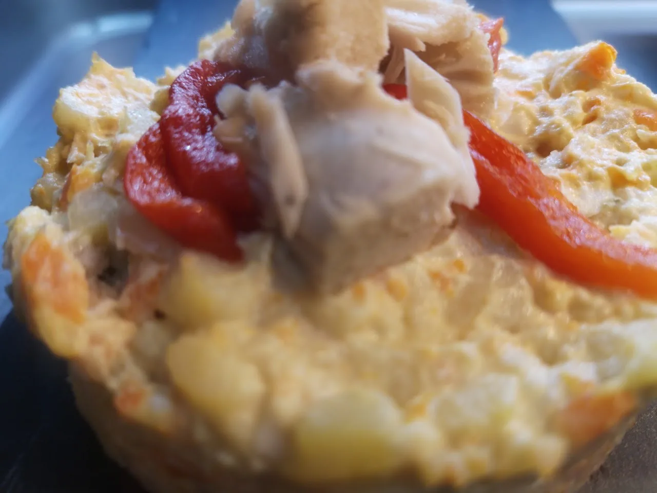 A pastry tart topped with crab and roasted red pepper