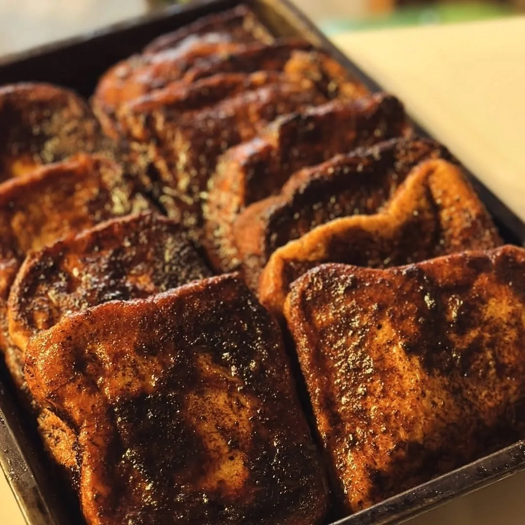 Rows of golden toasted slices in a tray