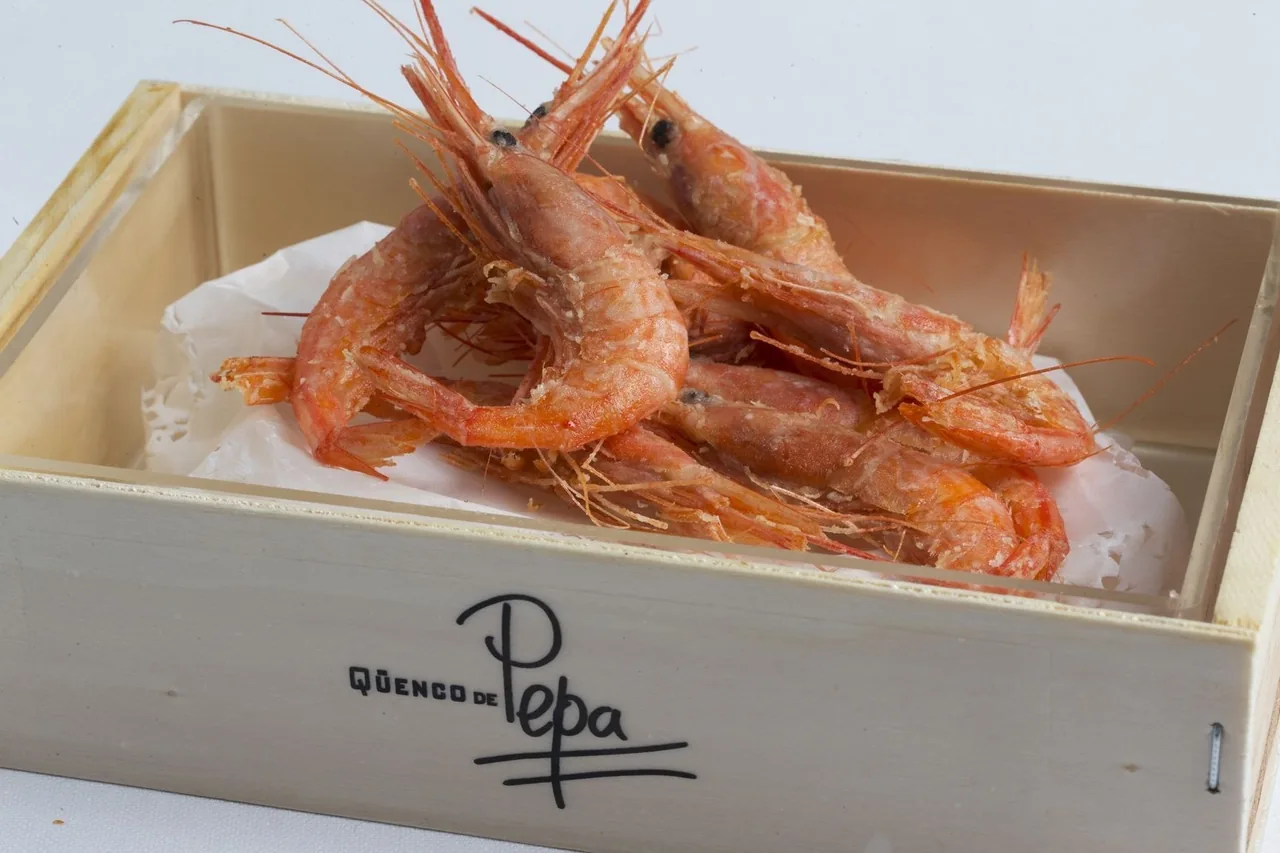 Red prawns in a small wooden box