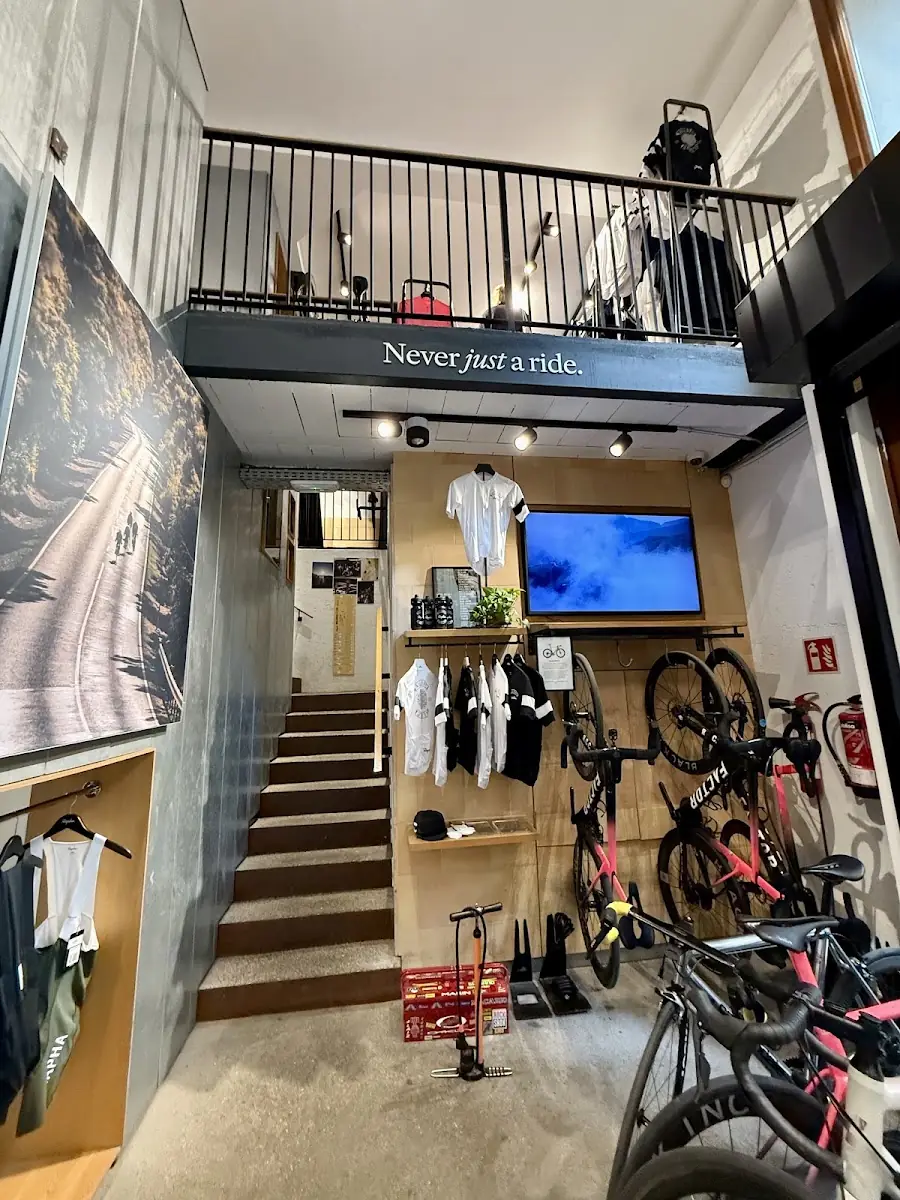 Inside the Rapha Mallorca clubhouse, bikes and jerseys beneath the mezzanine