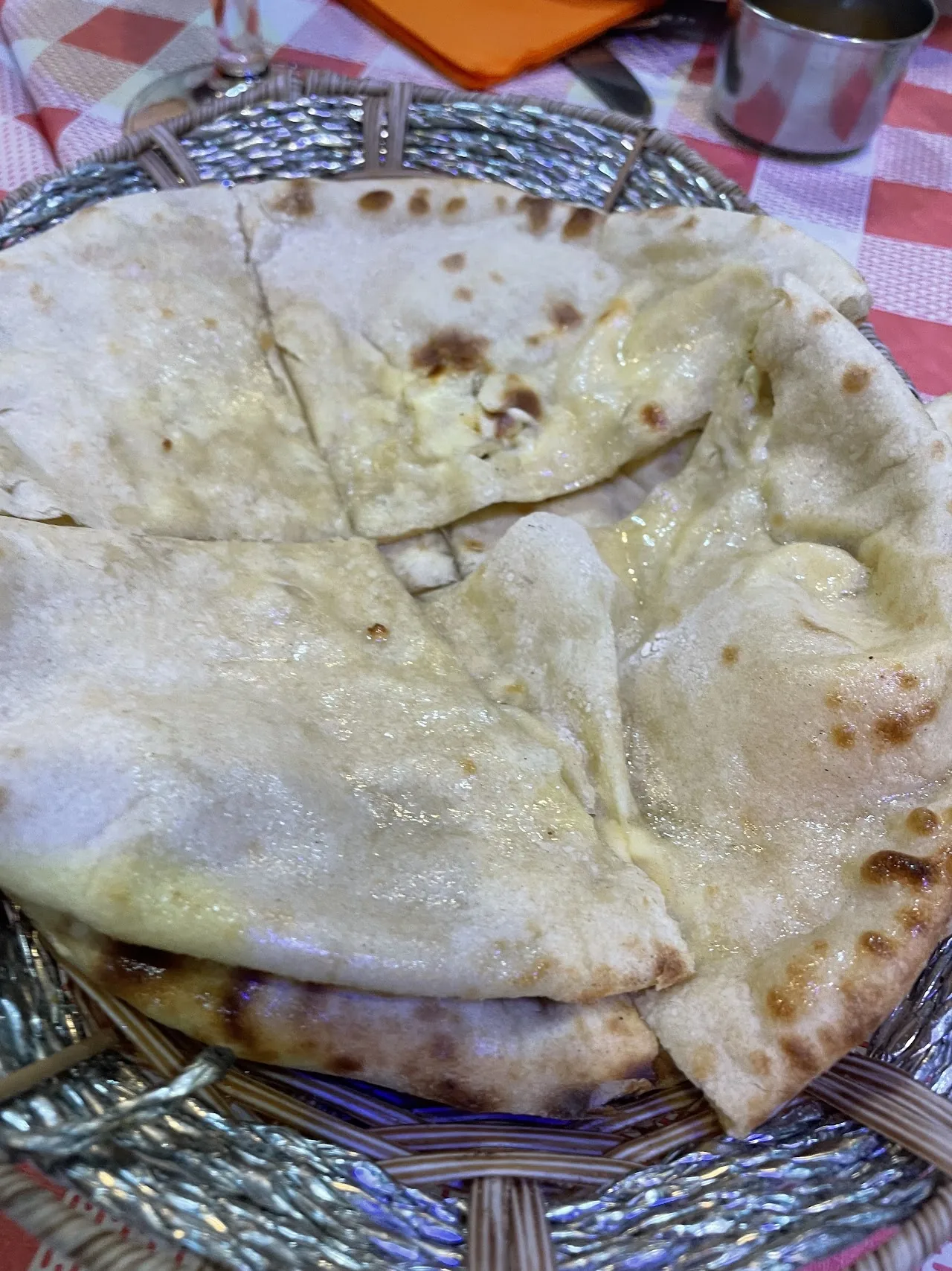 A basket of warm naan bread
