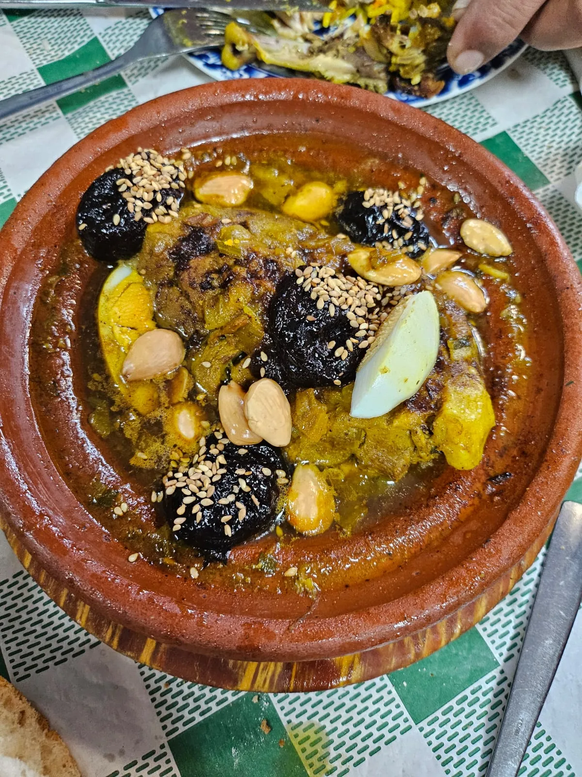 A tagine of stewed meat with olives, preserved lemon and almonds