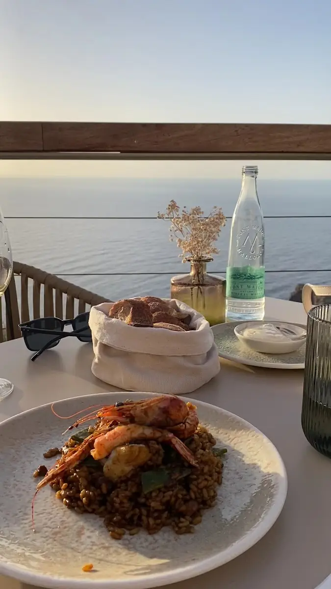Paella at sunset over the Deià coast at Sa Foradada