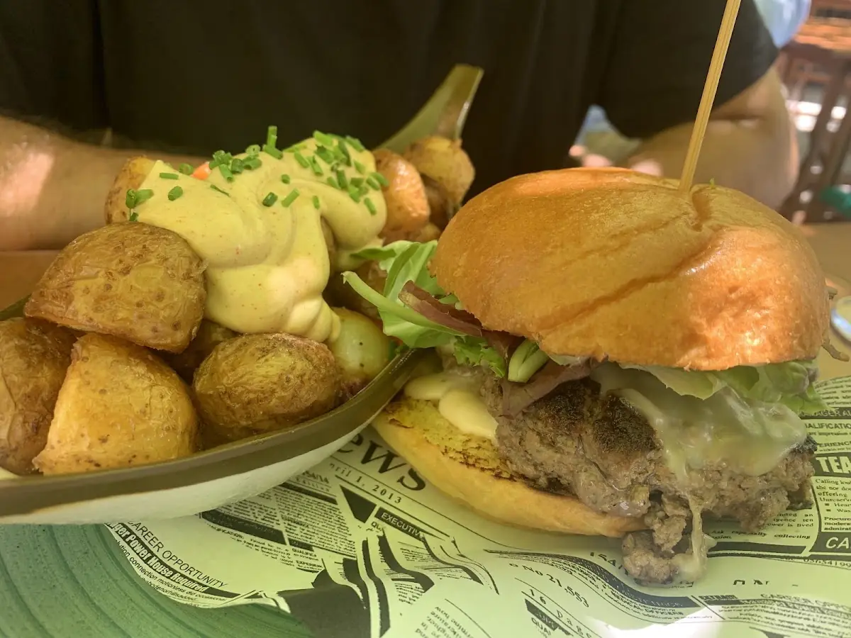 A burger with potatoes at Sa Fonda