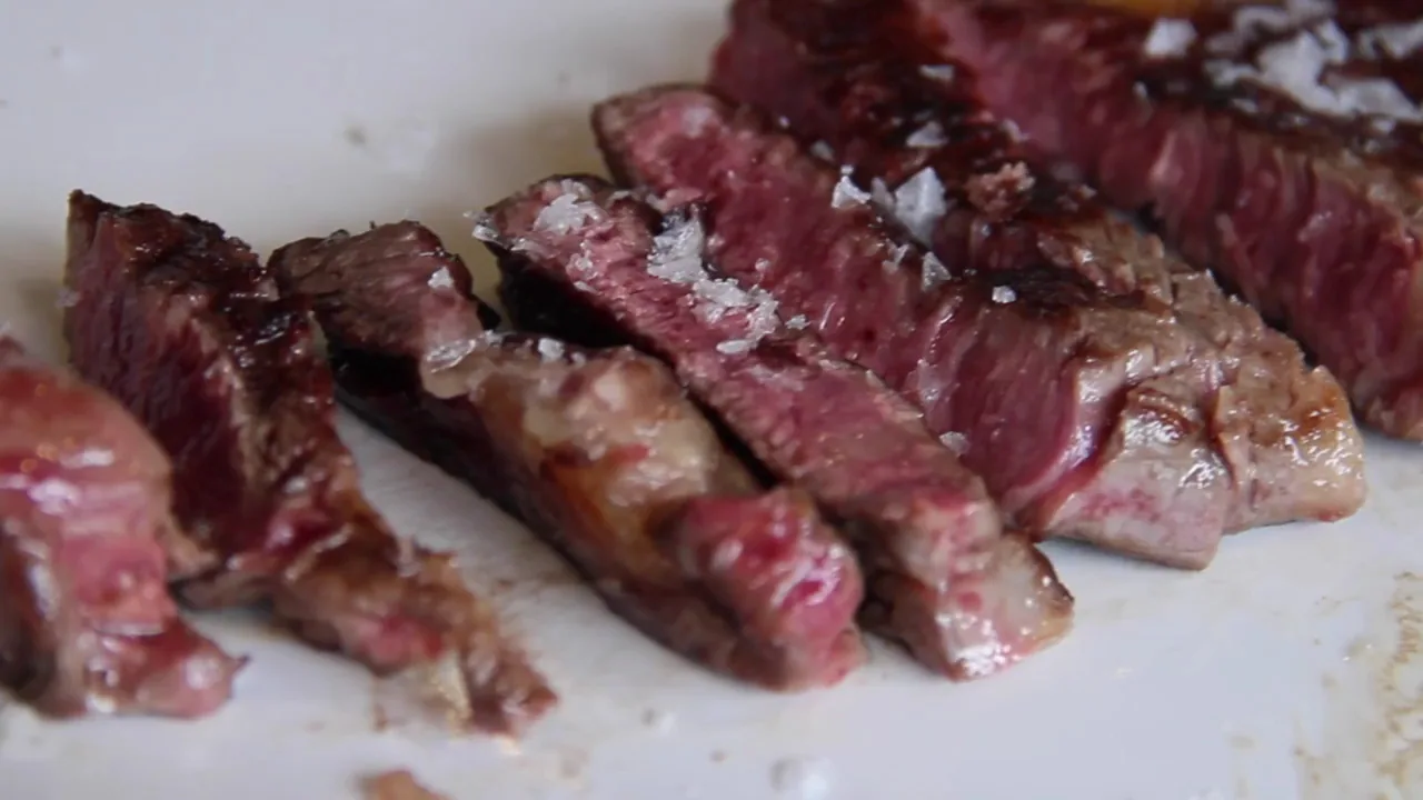 Slices of grilled steak seasoned with flaky salt