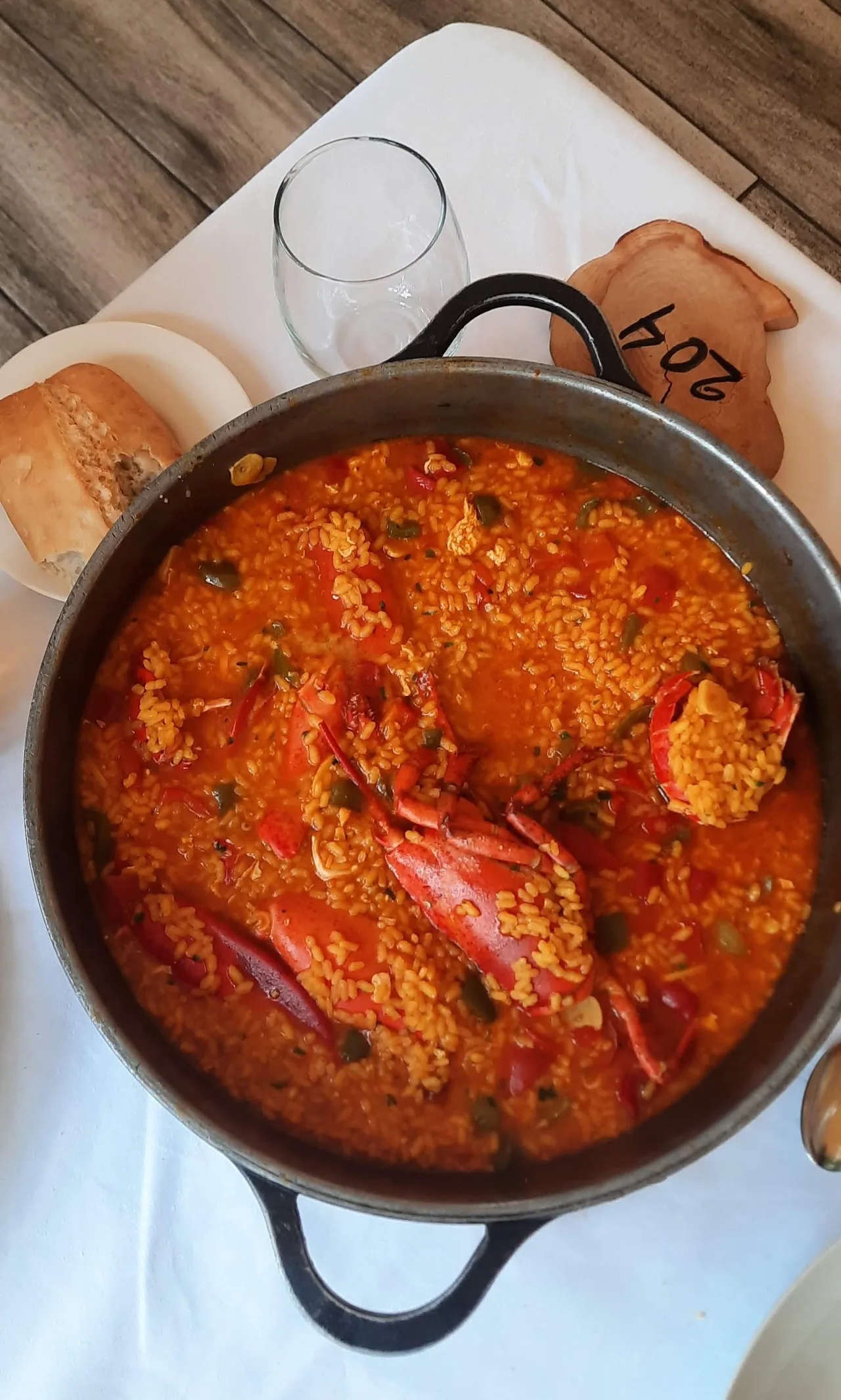 A pot of seafood and lobster stew in tomato sauce