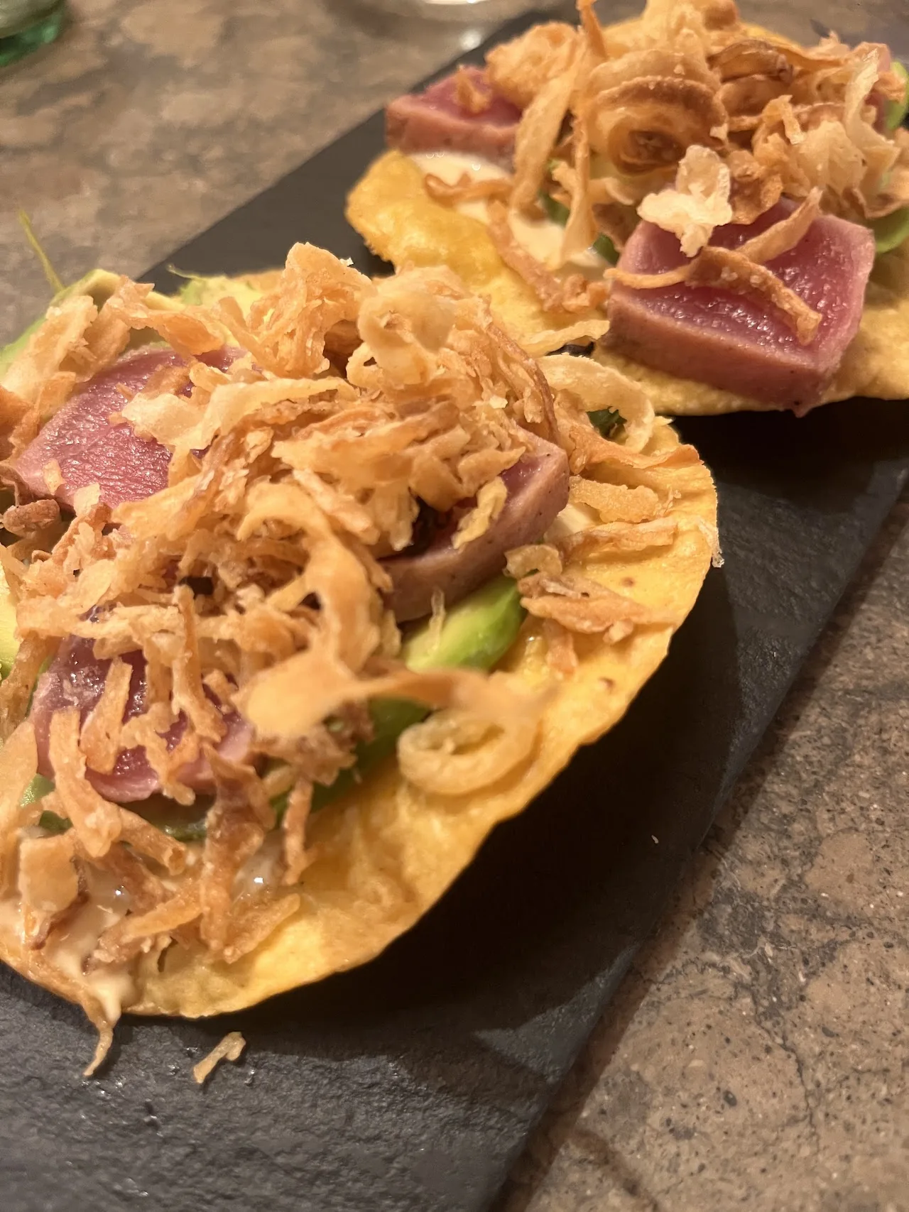 Tostadas topped with tuna and crispy fried onions