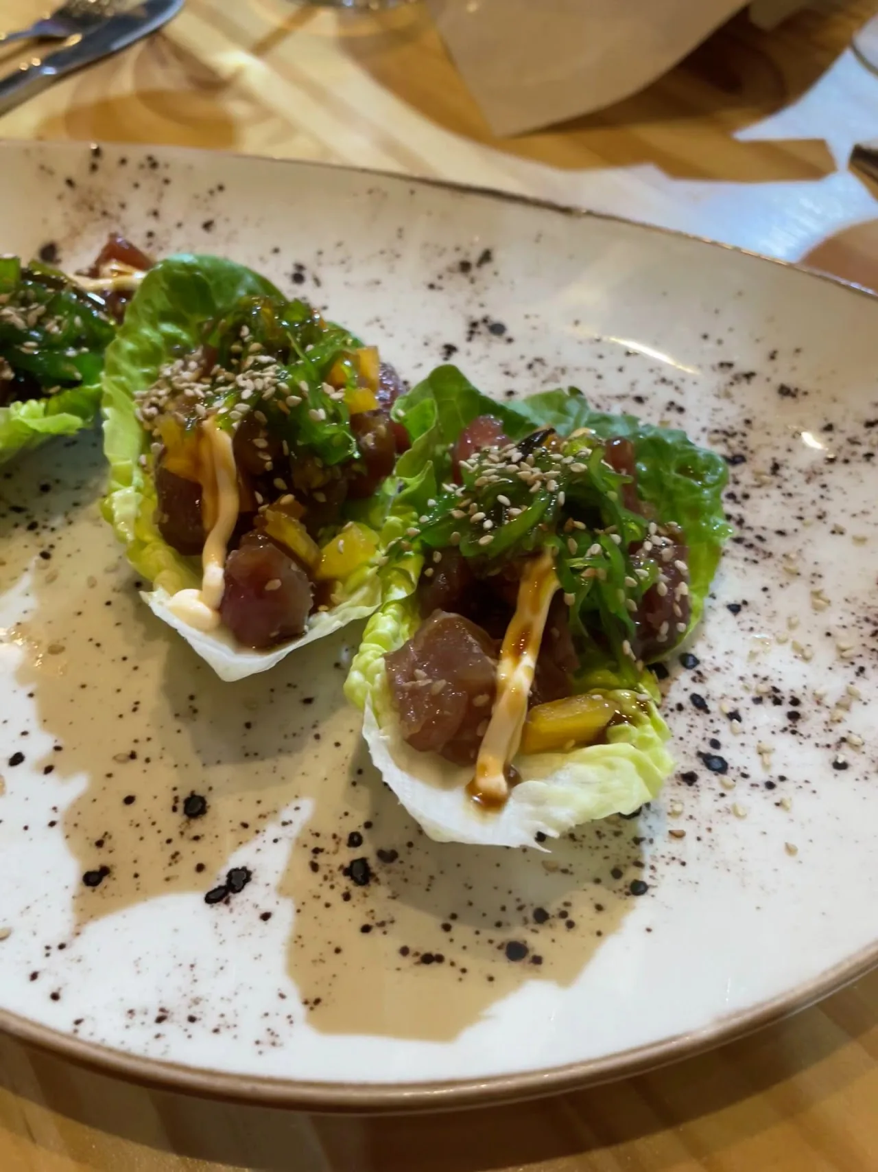 Lettuce cups filled with a savory filling and herbs