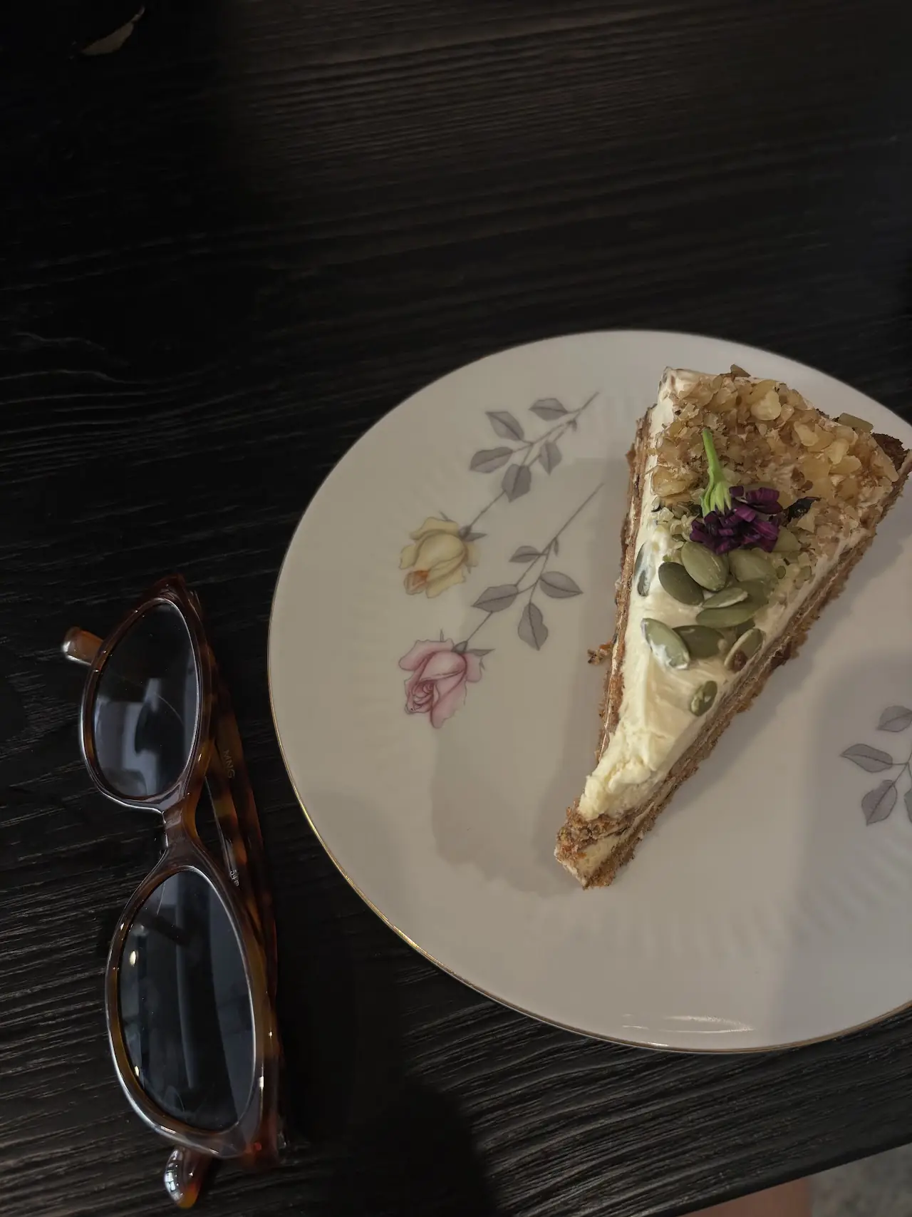 A slice of layered cake on a small patterned plate
