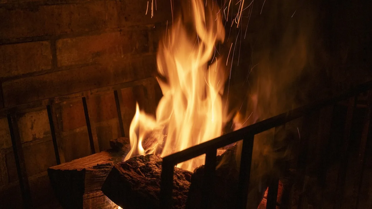 Flames burning in a brick fireplace