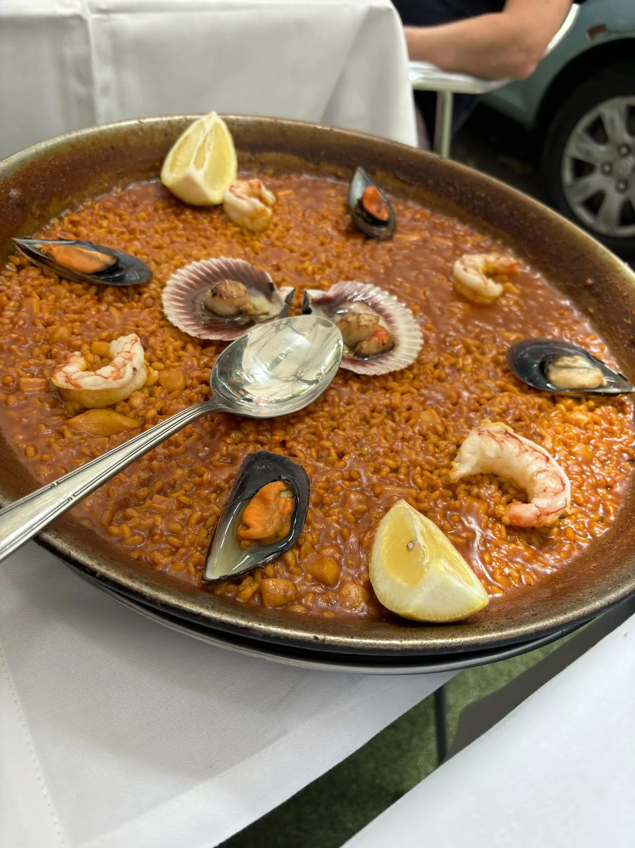 A pan of seafood paella with mussels, shrimp, and clams