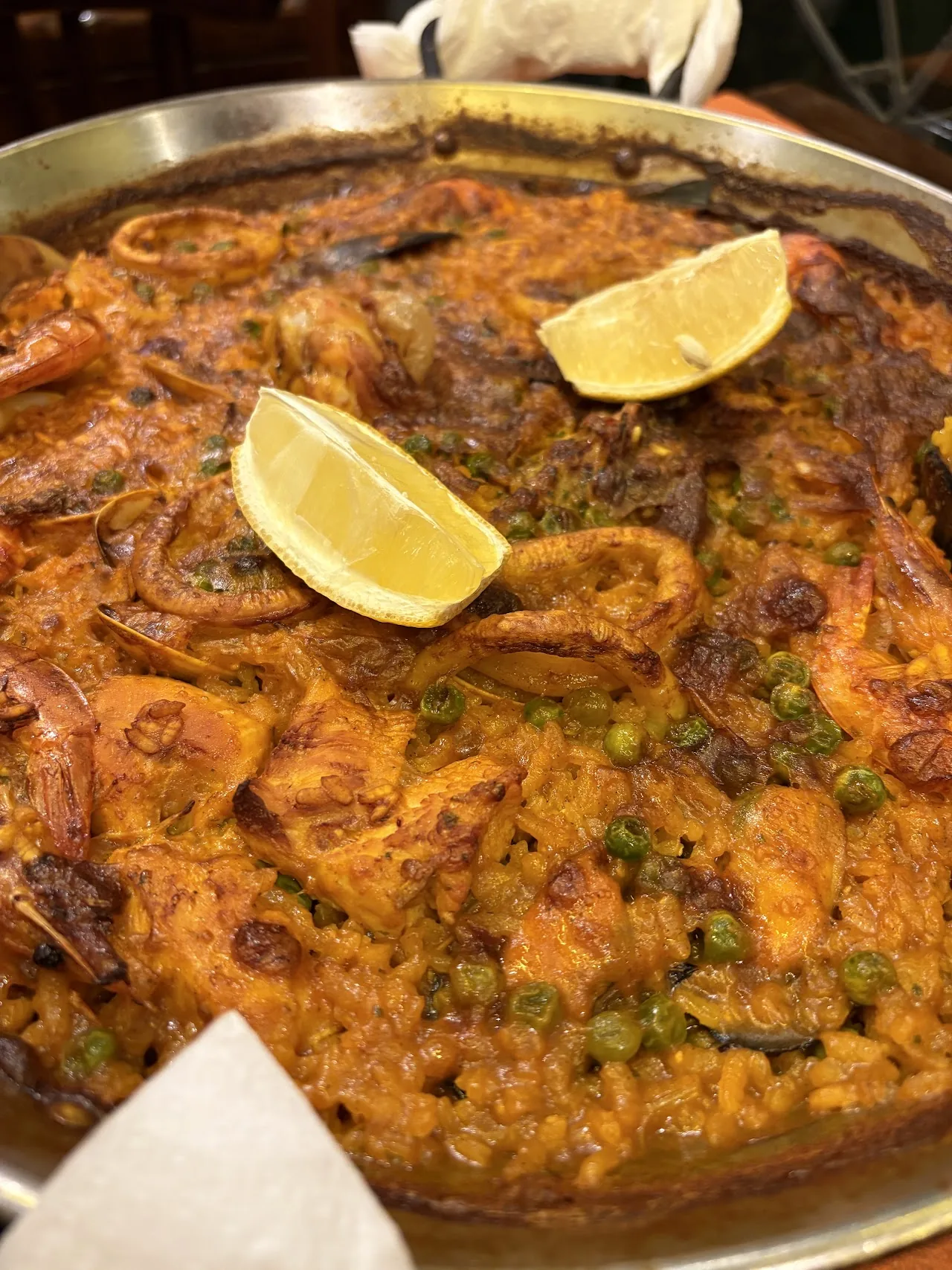 A seafood paella with shrimp and peas