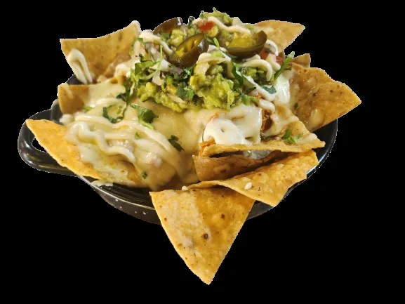 Tortilla chips topped with melted cheese, guacamole, and jalapeños