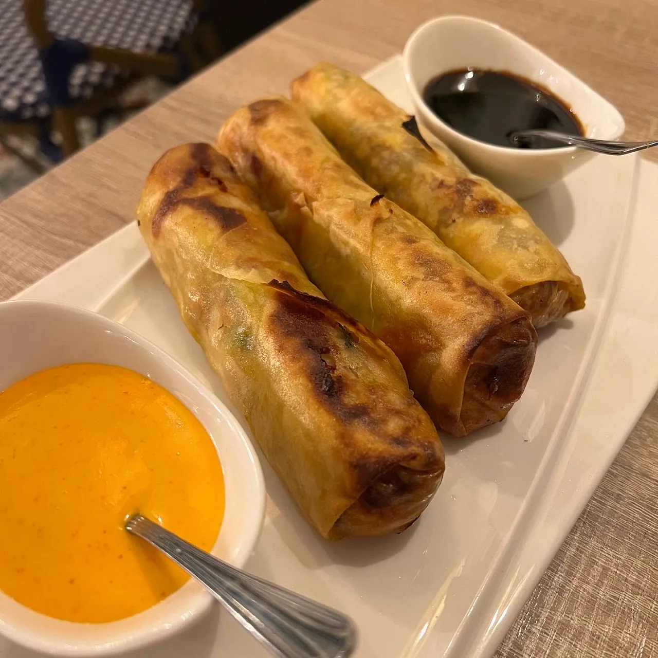 Fried spring rolls served with dipping sauces