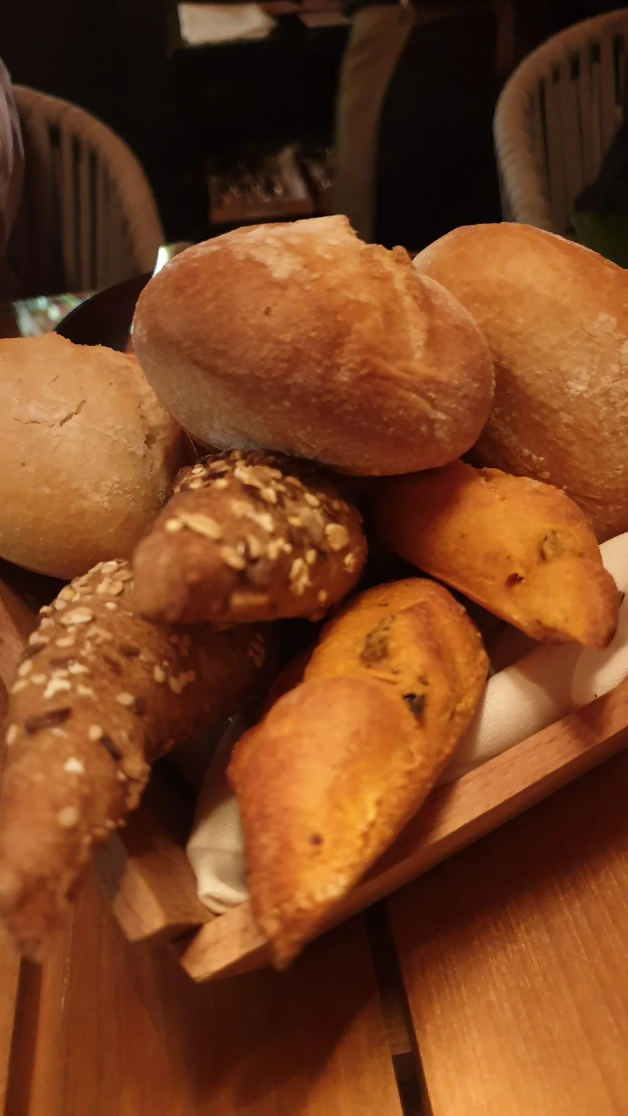 A basket of assorted fresh bread rolls