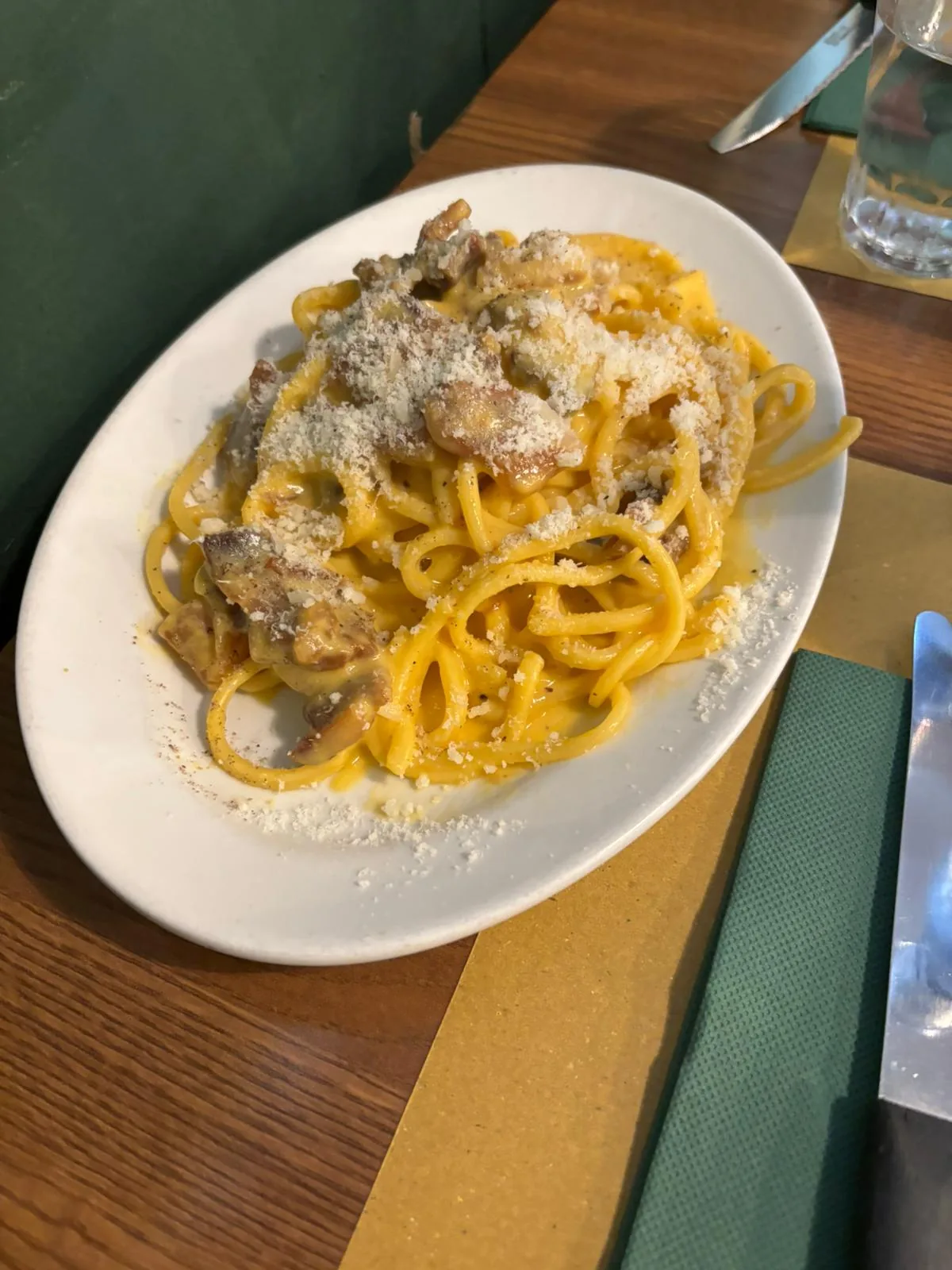 A plate of linguine pasta in a creamy mushroom sauce