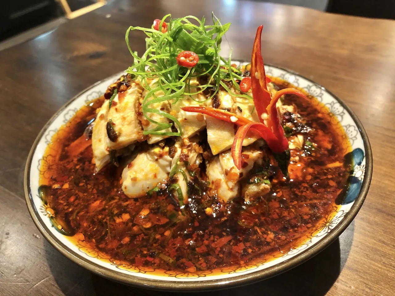 Sliced meat in spicy chili oil with scallions and dried chilies
