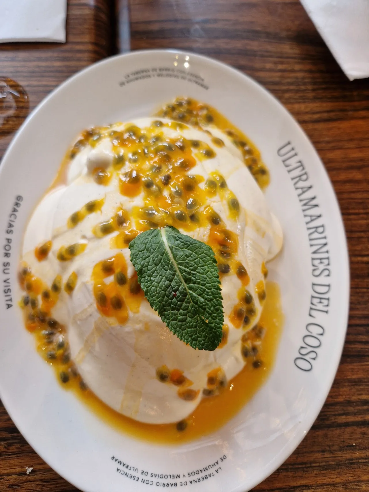 Burrata cheese with passion fruit sauce and edible flowers