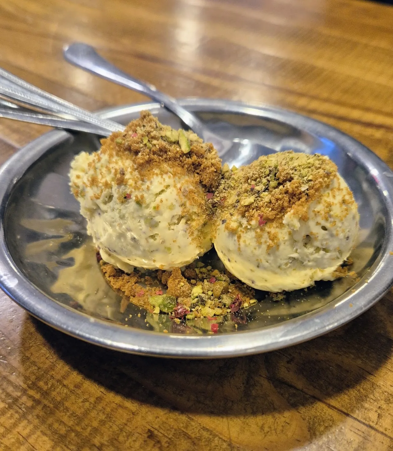Two round fried fritters garnished with herbs